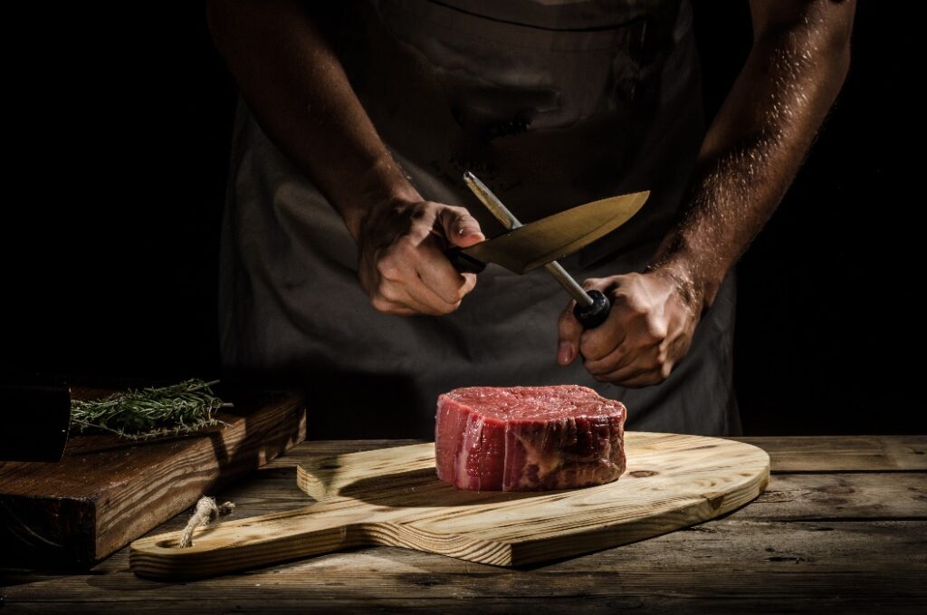 Chef butcher prepare beef steak